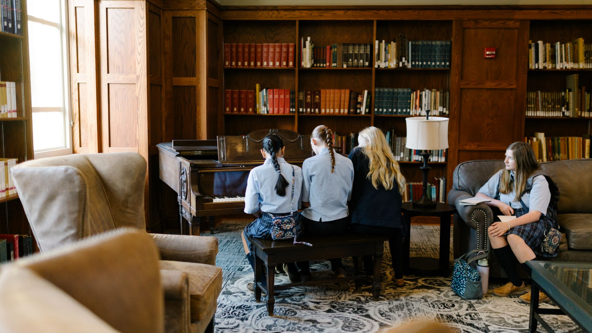 Best Boarding Schools in the US. Students play piano at St Bernard Prep School.